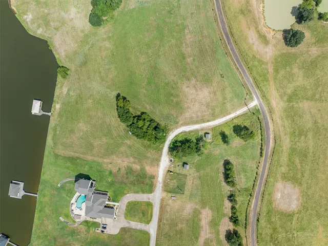 a view of a lake with a big yard