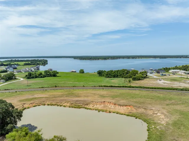 a view of a lake with a yard