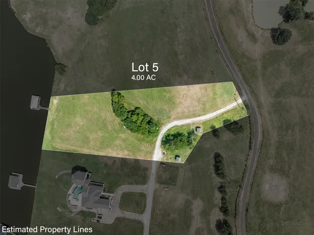 a view of a swimming pool with a yard