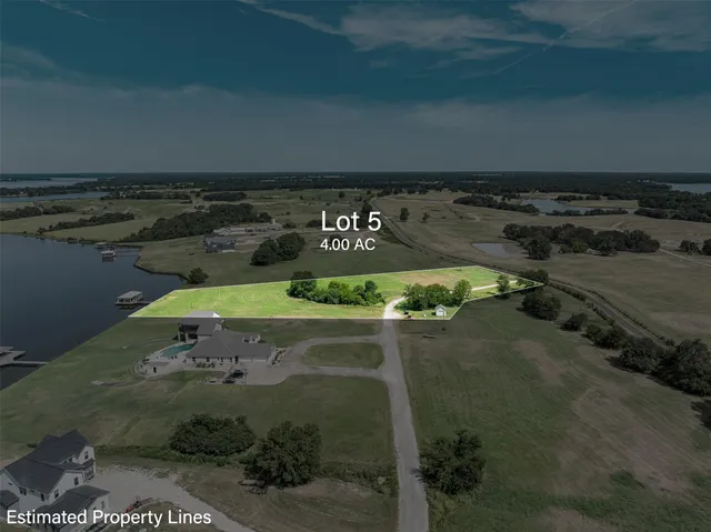 an aerial view of a golf course with parking space