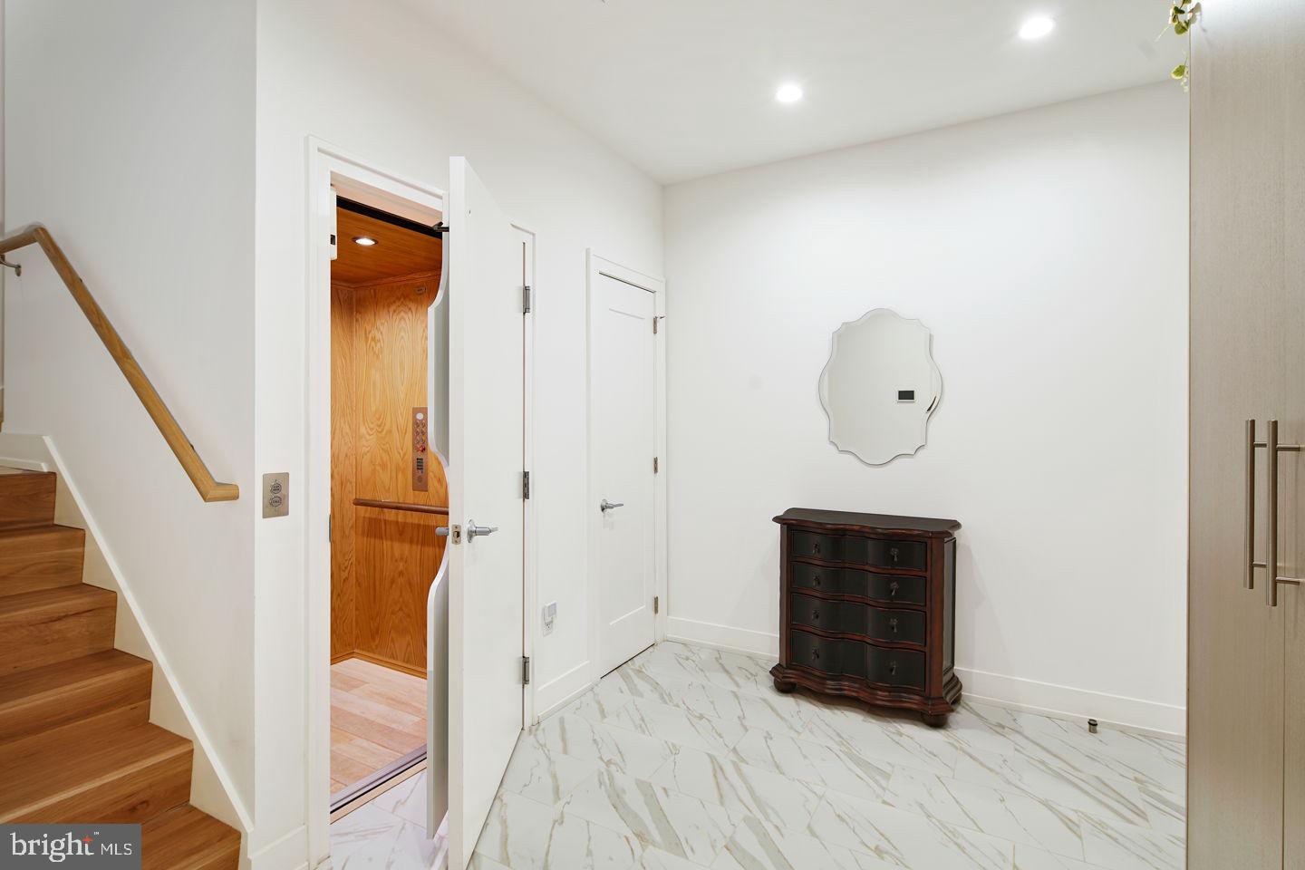 249 South 24th Street, Unit C Philadelphia, PA 19103 - Photo 20 of 35 a view of room with wooden floor and staircase