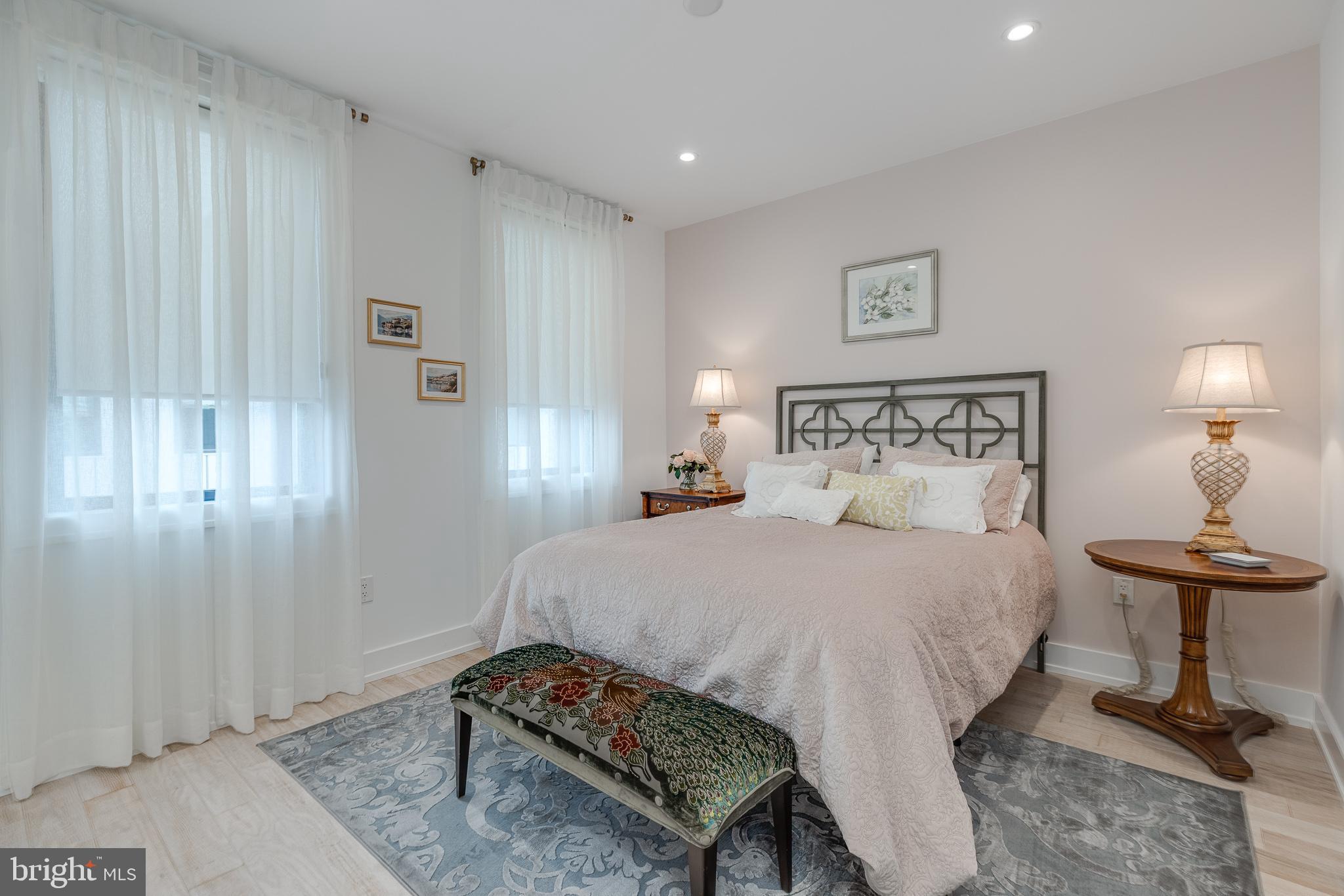 249 South 24th Street, Unit C Philadelphia, PA 19103 - Photo 22 of 35 a bedroom with a bed and a table