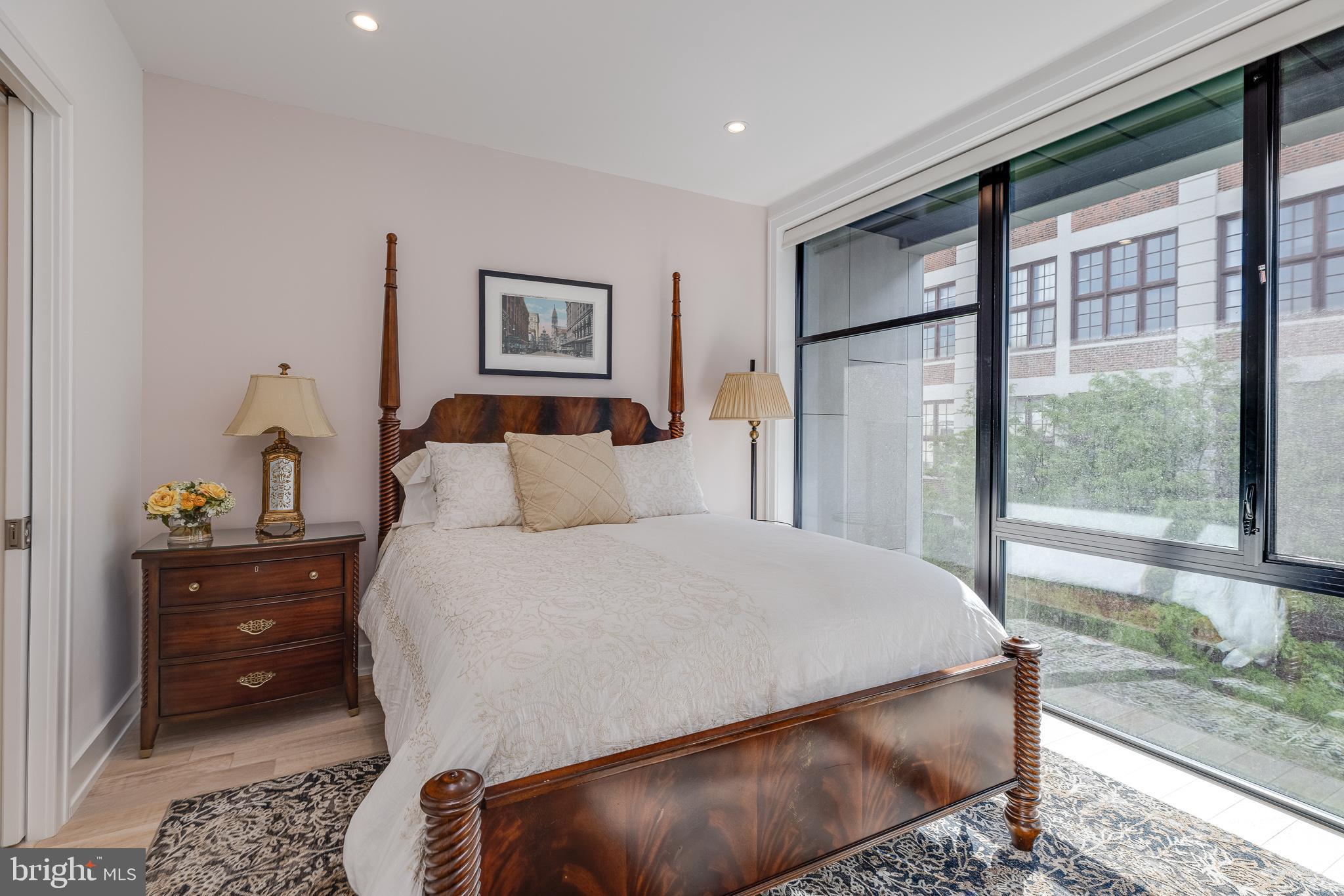 249 South 24th Street, Unit C Philadelphia, PA 19103 - Photo 23 of 35 a bedroom with a bed and wooden floor