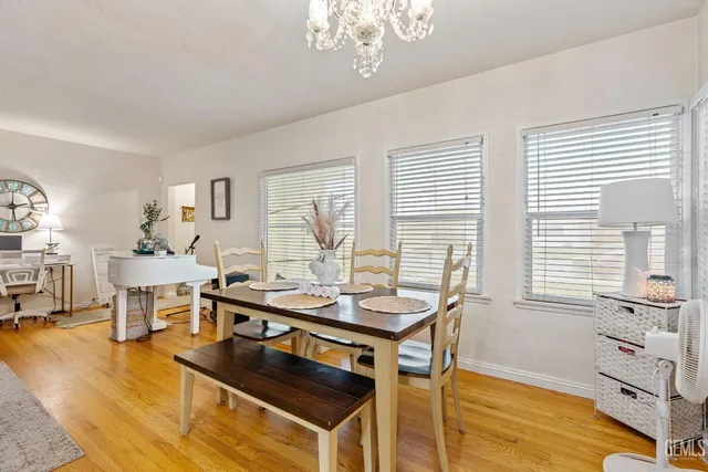 a view of a dining room with furniture and a window