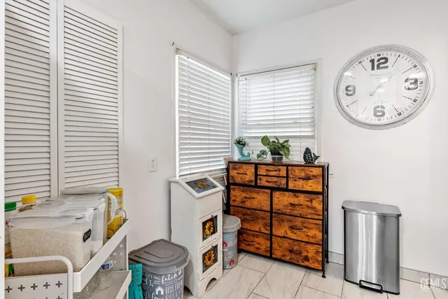 a bathroom with a toilet a sink and a window
