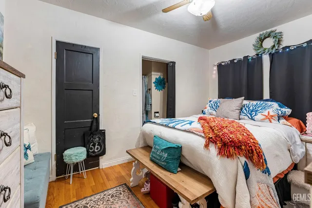 a bedroom with furniture and a window