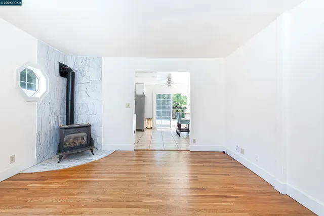 a room with wooden floor and furniture