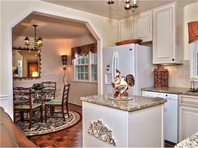 5301 Pelham Road Durham, NC 27713 - Photo 11 of 25 At Your Service _ The kitchen work island makes cooking easier. Island is Moveable. Wonderfully Updated with Gleaming Granite and Glazed High End Cabinetry. Kitchen