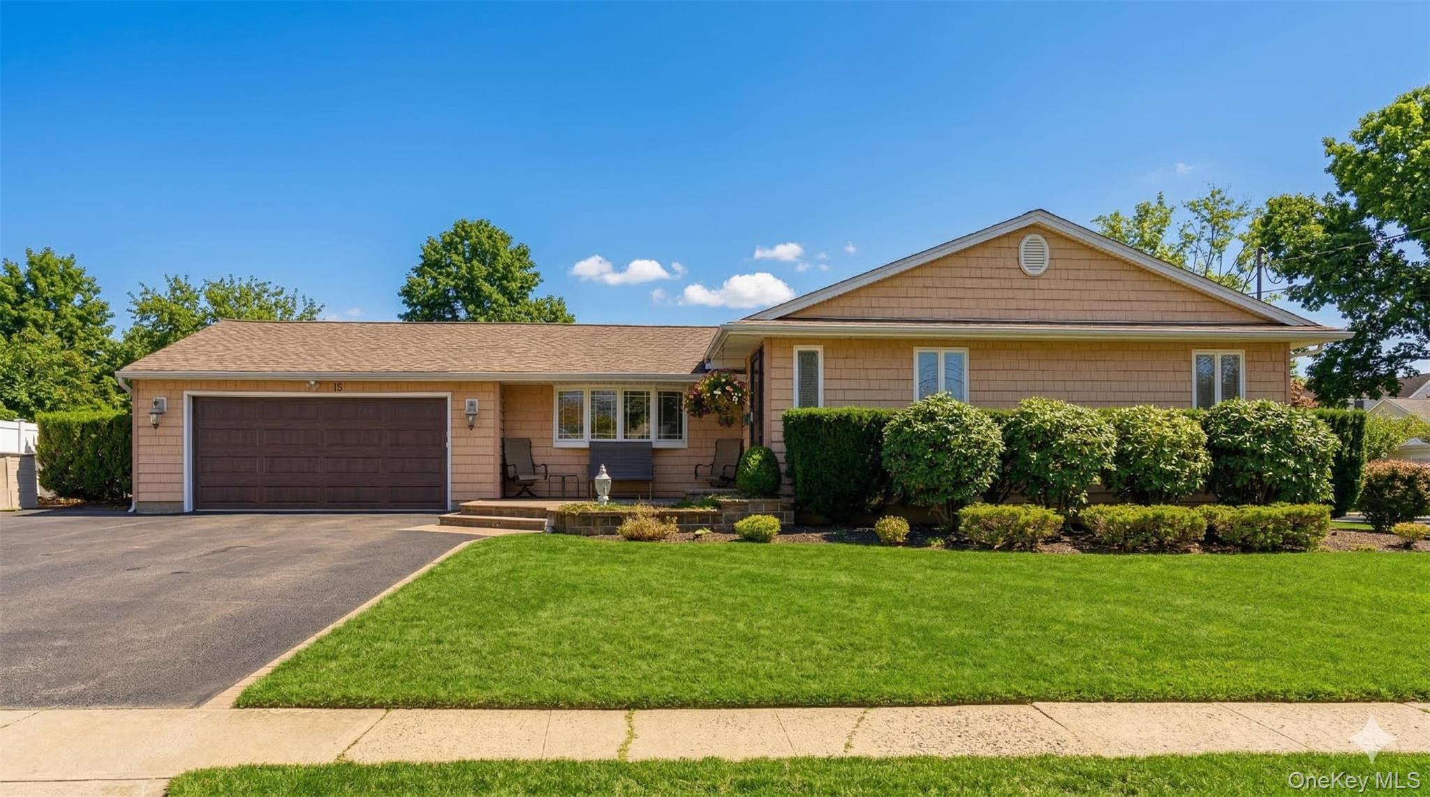 a front view of a house with a yard and porch