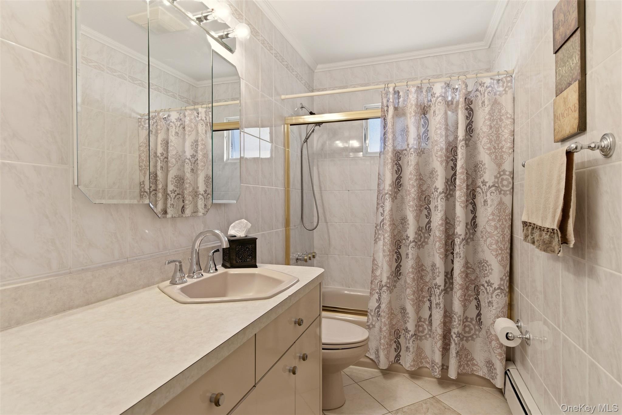 15 Leeward Lane Commack, NY 11725 - Photo 16 of 26 a bathroom with a sink toilet and shower