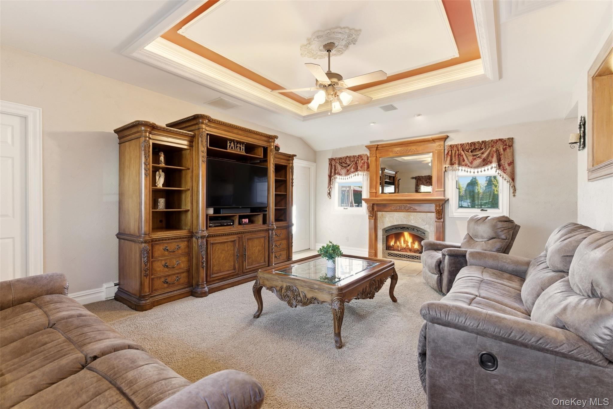 15 Leeward Lane Commack, NY 11725 - Photo 4 of 26 a living room with furniture and a flat screen tv
