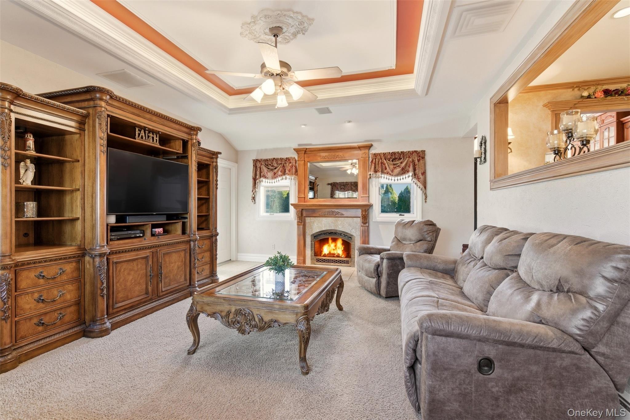 15 Leeward Lane Commack, NY 11725 - Photo 5 of 26 a living room with furniture and a flat screen tv