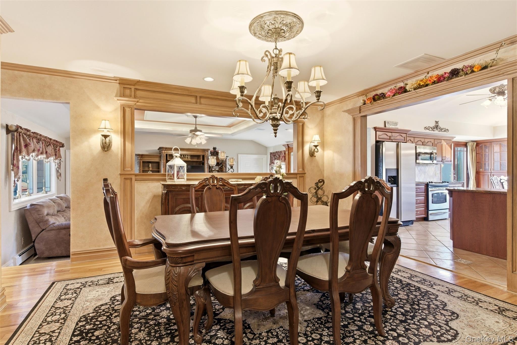 15 Leeward Lane Commack, NY 11725 - Photo 6 of 26 a view of a dining room with furniture and chandelier