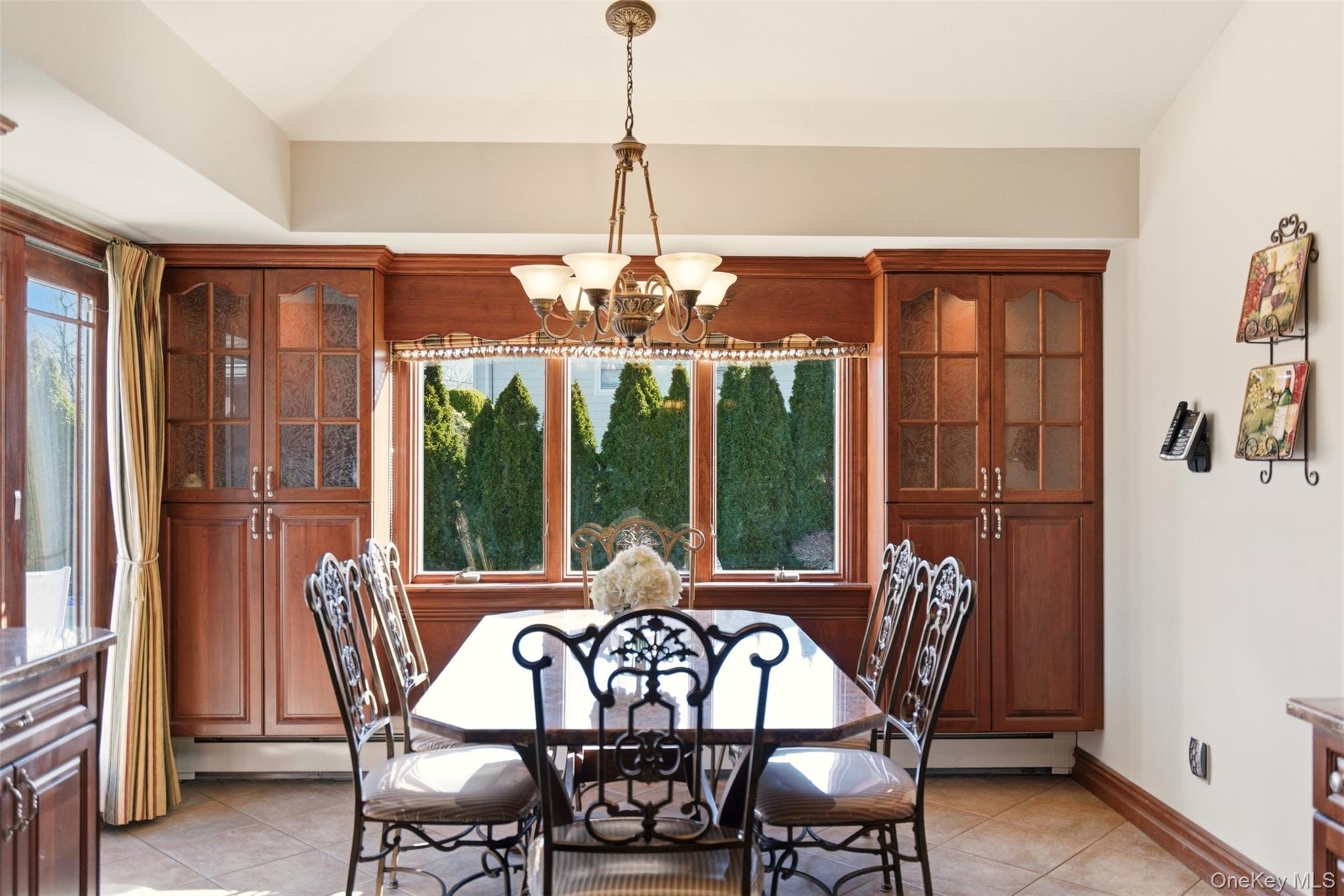 15 Leeward Lane Commack, NY 11725 - Photo 10 of 26 a view of a dining room with furniture window and outside view