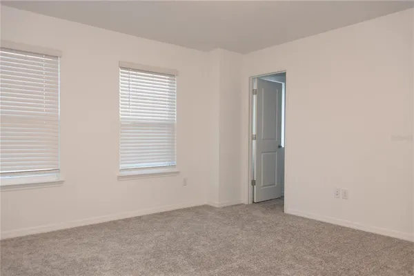 an empty room with a washer and dryer