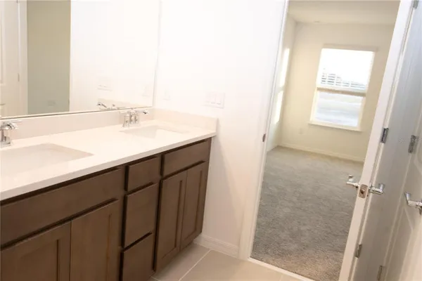 a bathroom with a toilet and a mirror