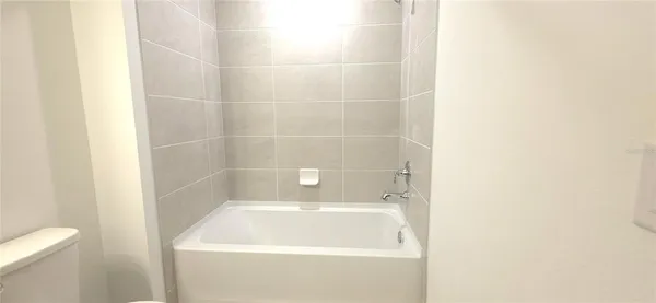 a picture of a bathroom with a window