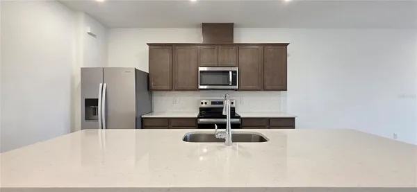 a view of a storage & utility room with two washing machine