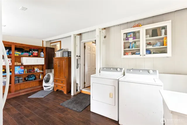 a view of a livingroom with furniture and a window