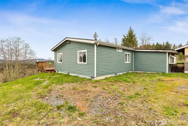 a view of a backyard of the house