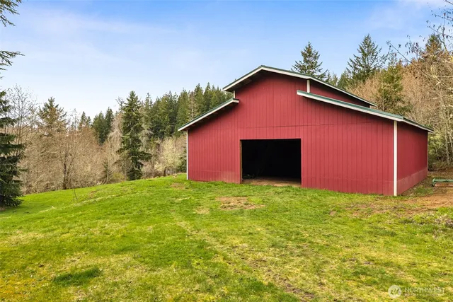 a yellow house with a yard