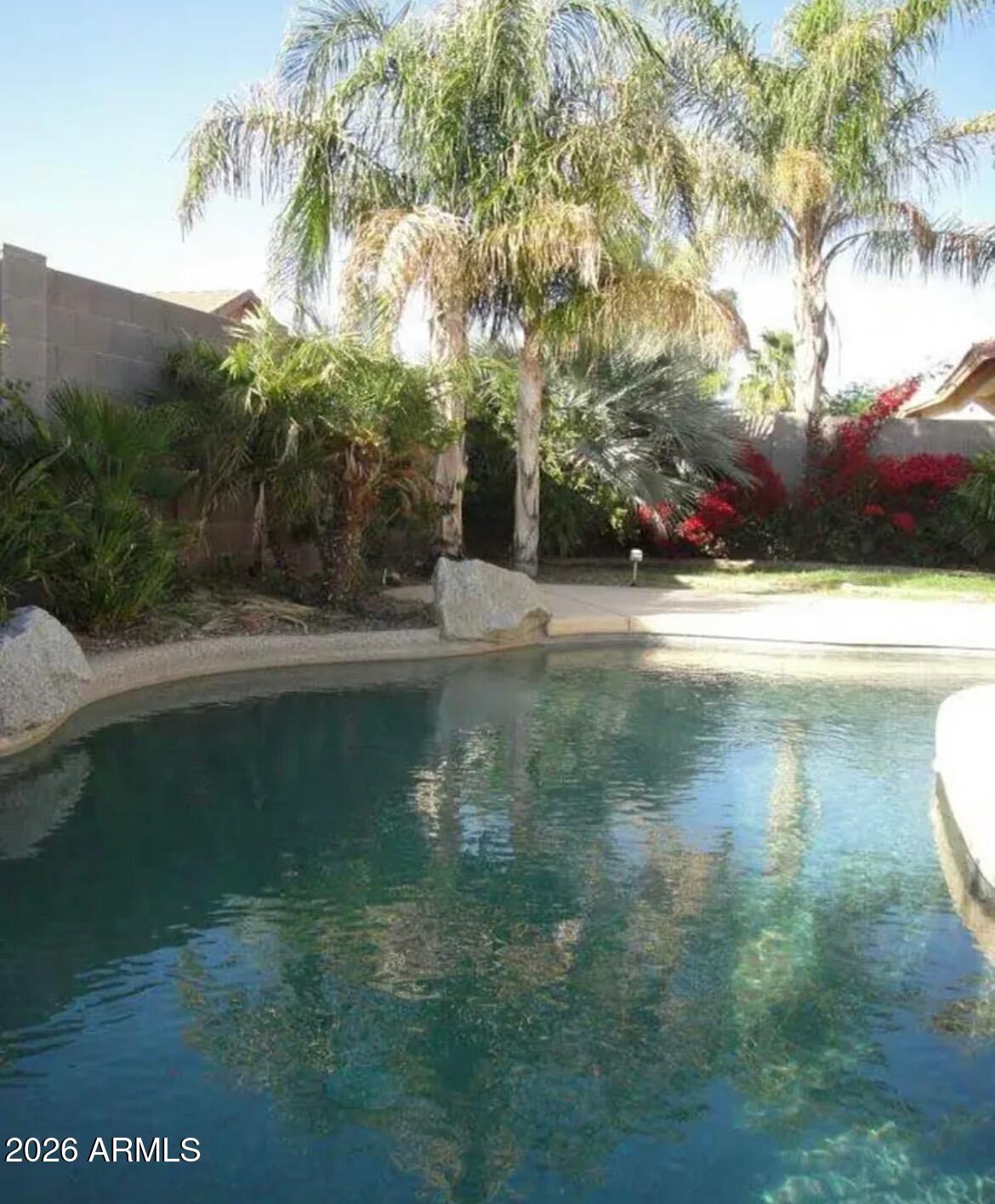3674 South Joshua Tree Lane Gilbert, AZ 85297 - Photo 3 of 30 a view of a lake from a yard