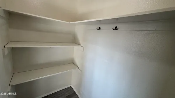 a view of an empty walk in closet