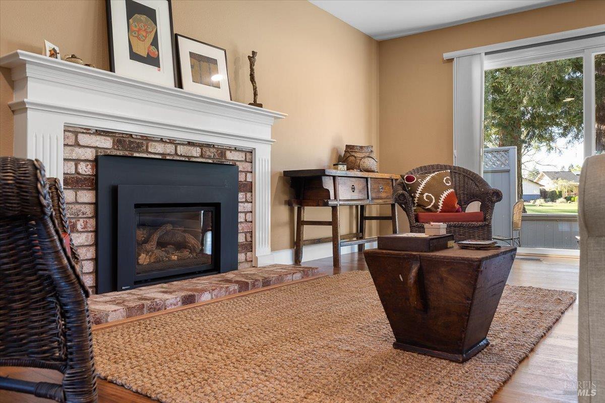 411 Twin Lakes Circle Santa Rosa, CA 95409 - Photo 11 of 41 a living room with furniture a window and a fireplace