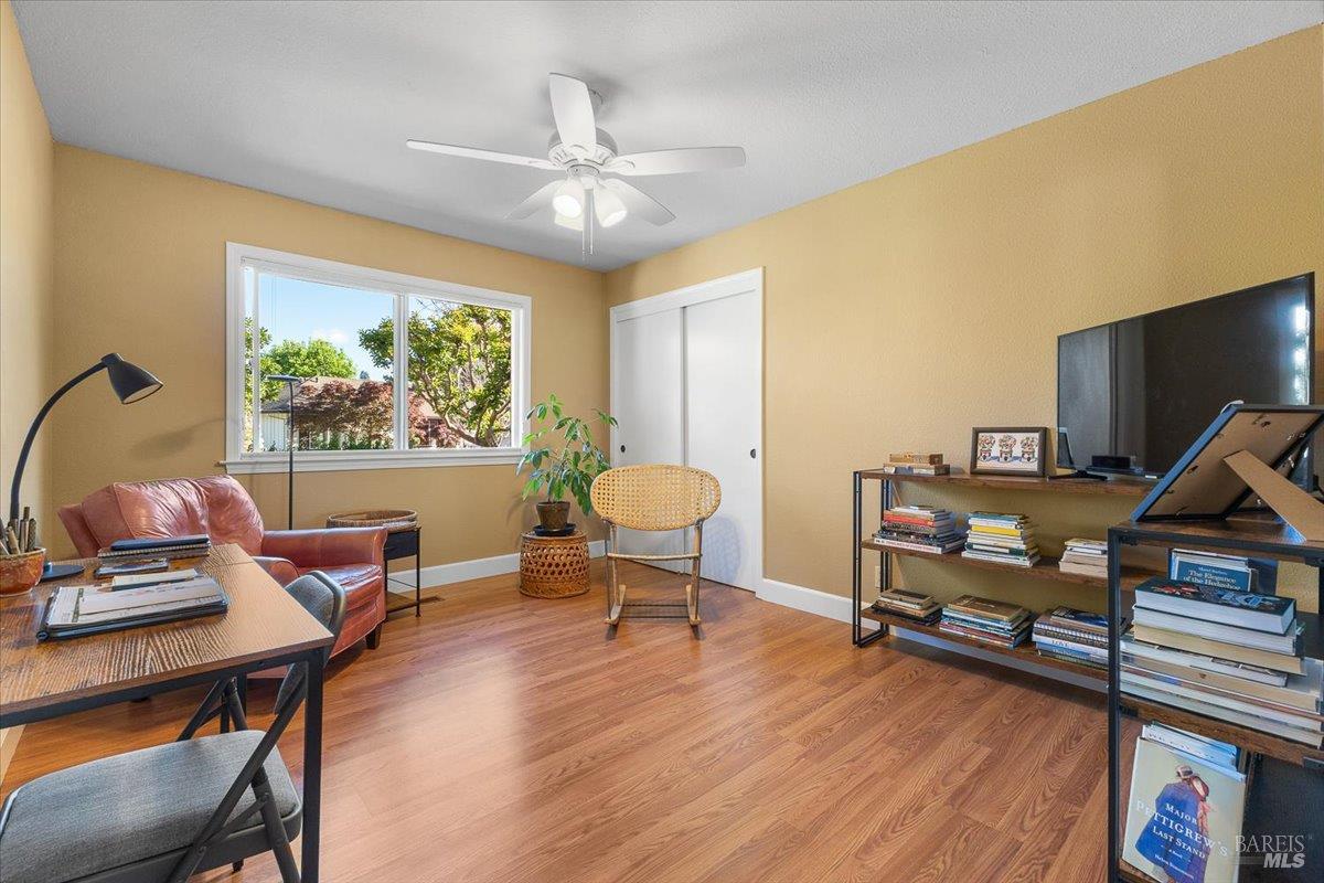 411 Twin Lakes Circle Santa Rosa, CA 95409 - Photo 13 of 41 a living room with furniture and a wooden floor