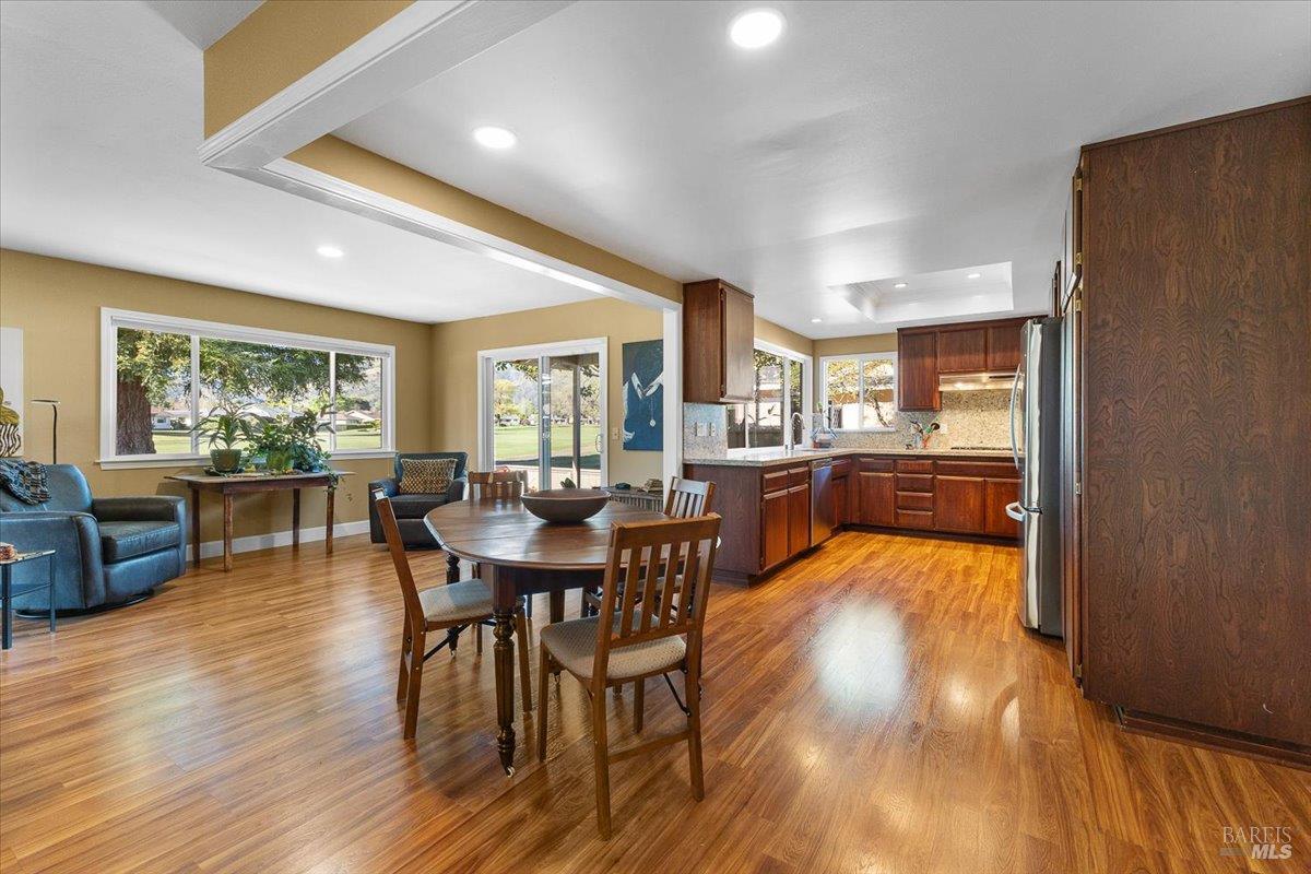 411 Twin Lakes Circle Santa Rosa, CA 95409 - Photo 15 of 41 a view of a dining room with furniture and wooden floor