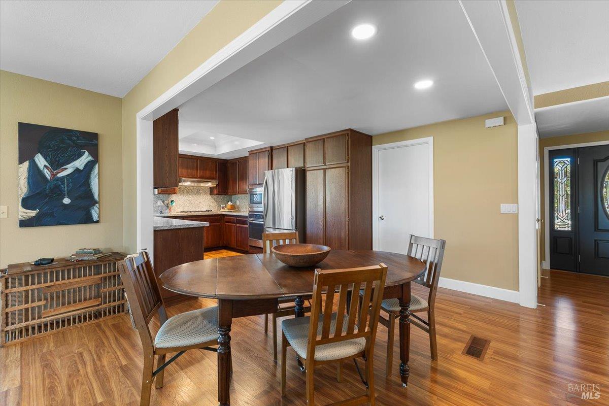 411 Twin Lakes Circle Santa Rosa, CA 95409 - Photo 16 of 41 a view of a dining room with furniture and wooden floor