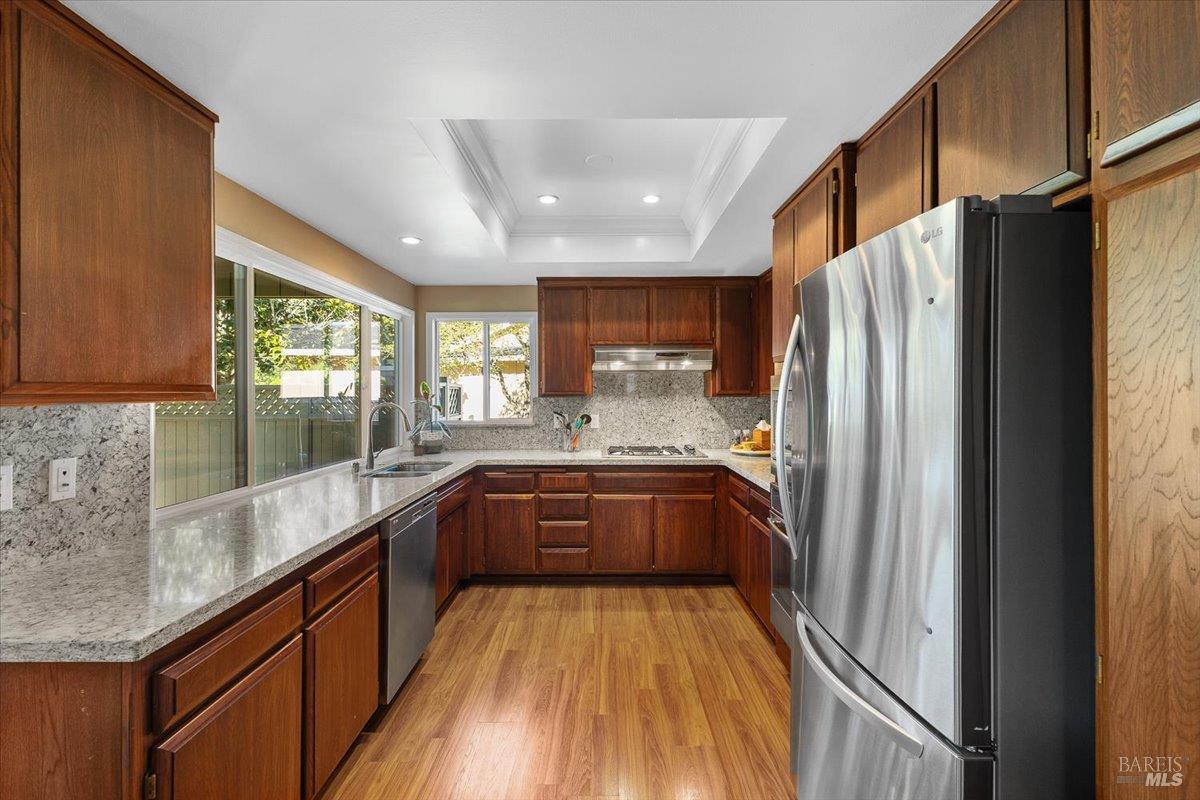 411 Twin Lakes Circle Santa Rosa, CA 95409 - Photo 18 of 41 a large kitchen with stainless steel appliances granite countertop a refrigerator and a sink