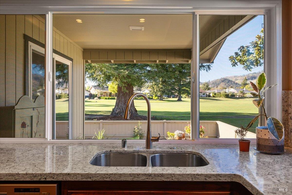 411 Twin Lakes Circle Santa Rosa, CA 95409 - Photo 20 of 41 a kitchen with a sink and large window