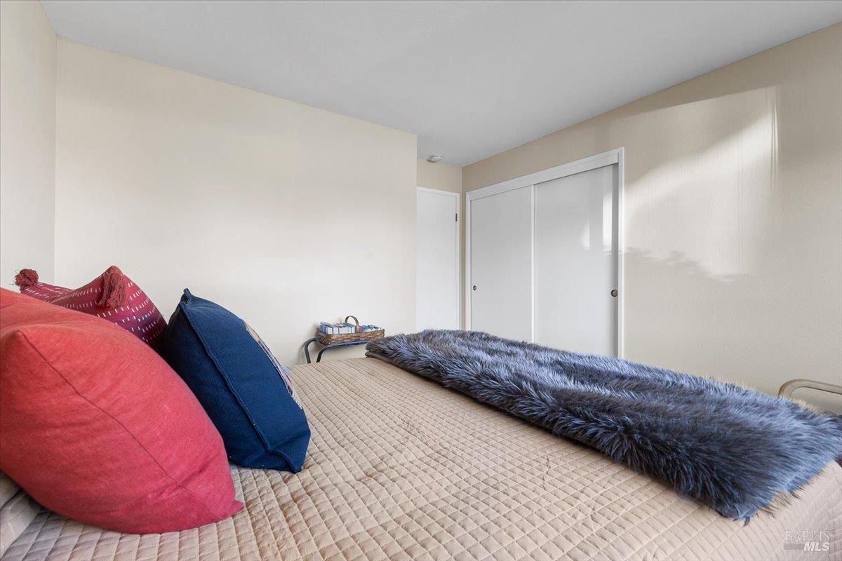 411 Twin Lakes Circle Santa Rosa, CA 95409 - Photo 22 of 41 a bedroom with a bed and a couch