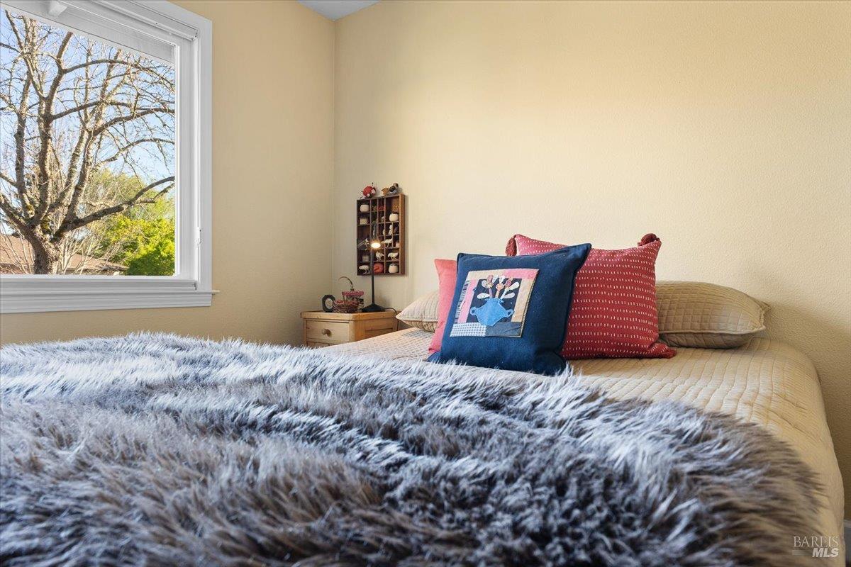 411 Twin Lakes Circle Santa Rosa, CA 95409 - Photo 23 of 41 a bedroom with a bed and a window