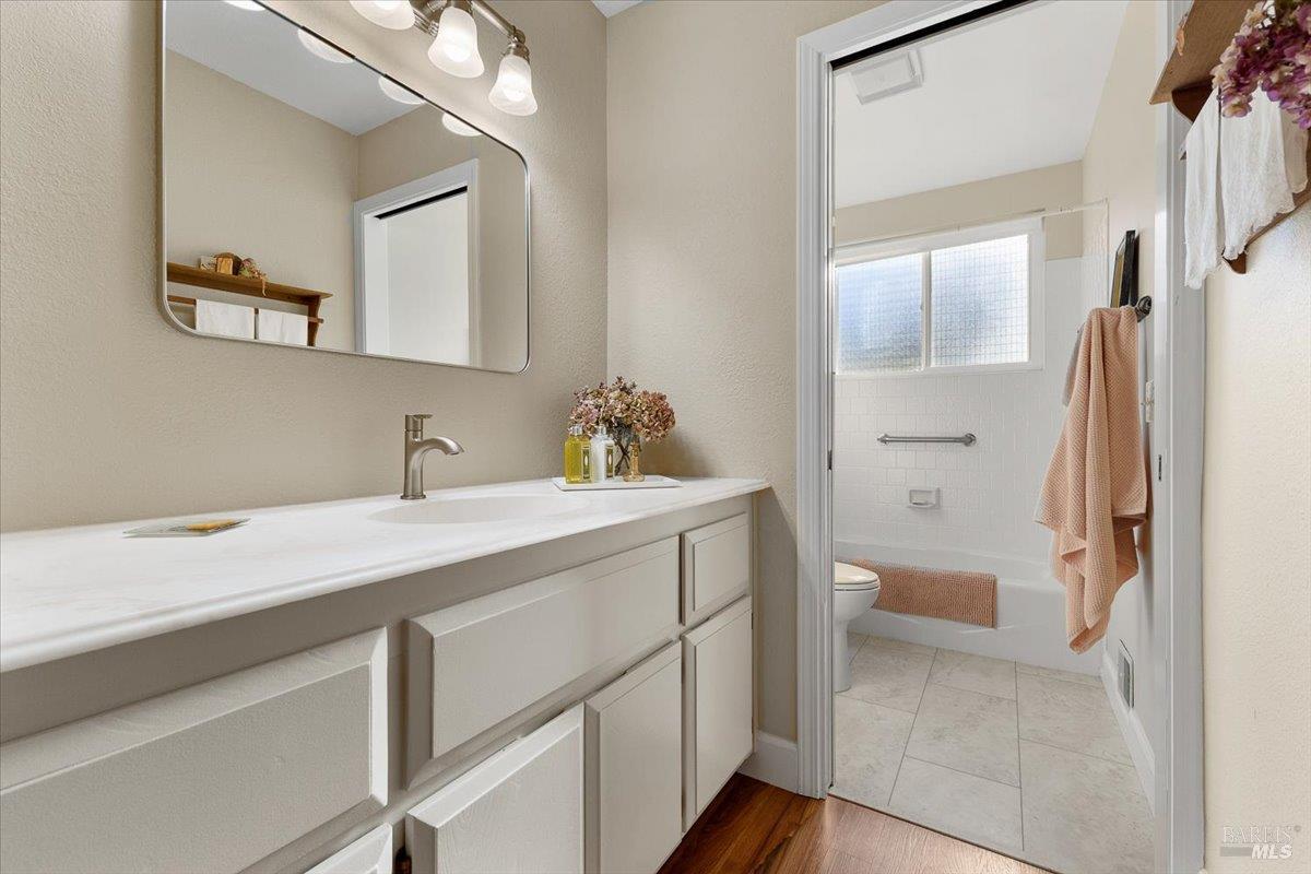 411 Twin Lakes Circle Santa Rosa, CA 95409 - Photo 30 of 41 a bathroom with a sink a toilet and shower