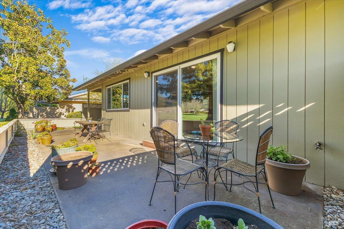 411 Twin Lakes Circle Santa Rosa, CA 95409 - Photo 36 of 41 a view of a patio with table and chairs and potted plants