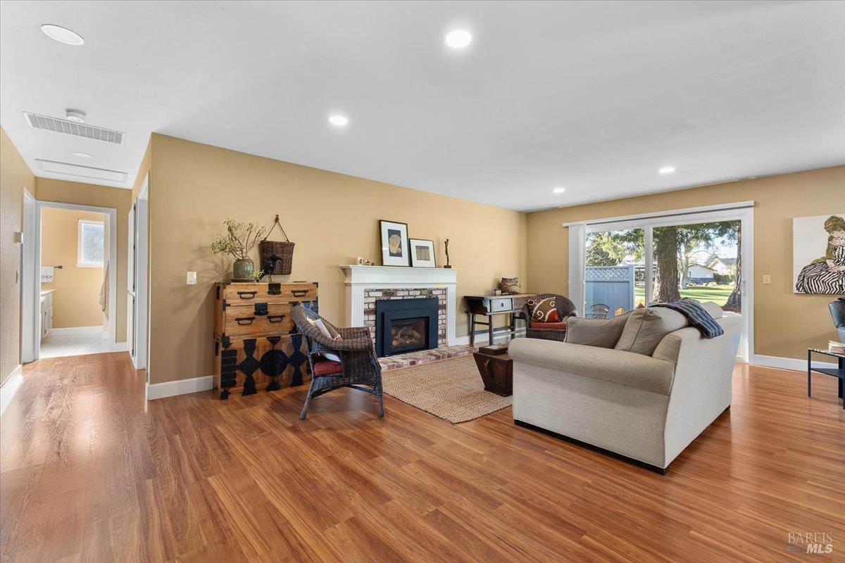 411 Twin Lakes Circle Santa Rosa, CA 95409 - Photo 7 of 41 a living room with furniture and a wooden floor