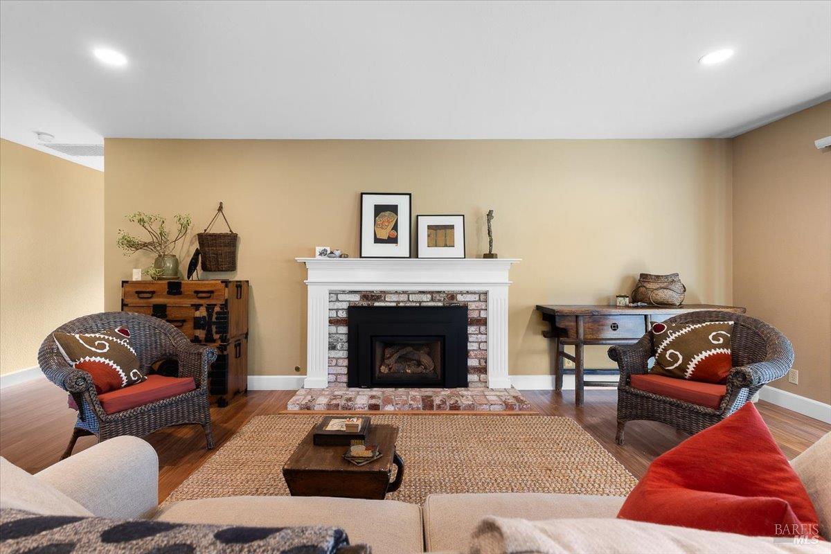 411 Twin Lakes Circle Santa Rosa, CA 95409 - Photo 8 of 41 a living room with furniture and a fireplace