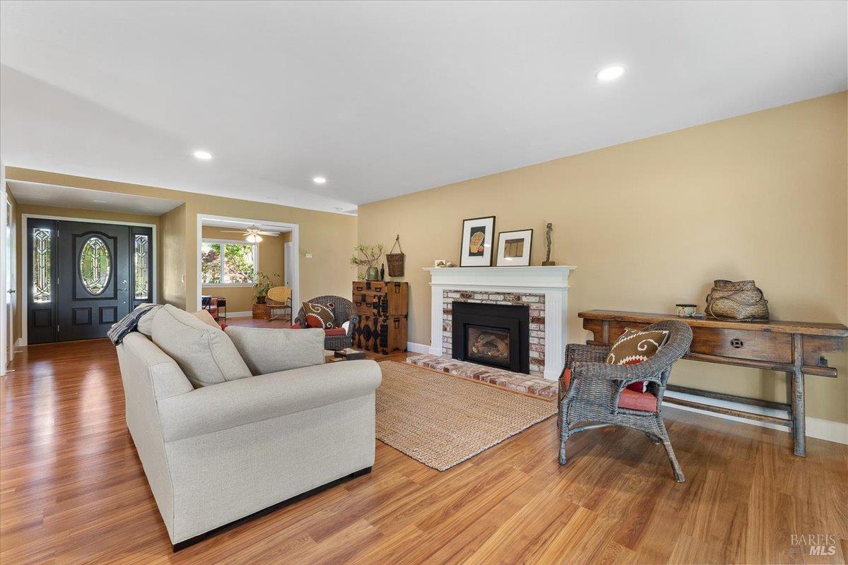 411 Twin Lakes Circle Santa Rosa, CA 95409 - Photo 9 of 41 a living room with furniture and a fireplace