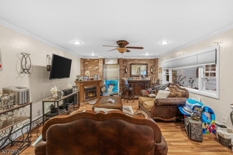 2785 Larchmont Road Union, NJ 07083 - Photo 8 of 15 a living room with furniture and a flat screen tv