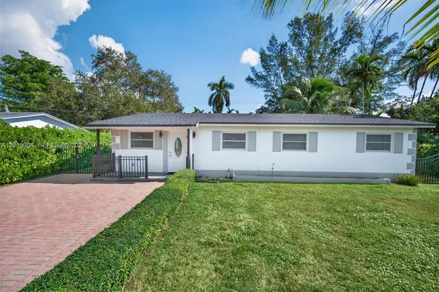 front view of a house with a garden