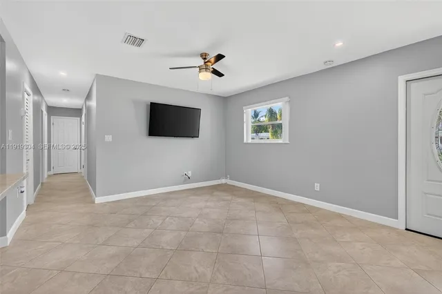 a bedroom with a bed a couch and a window