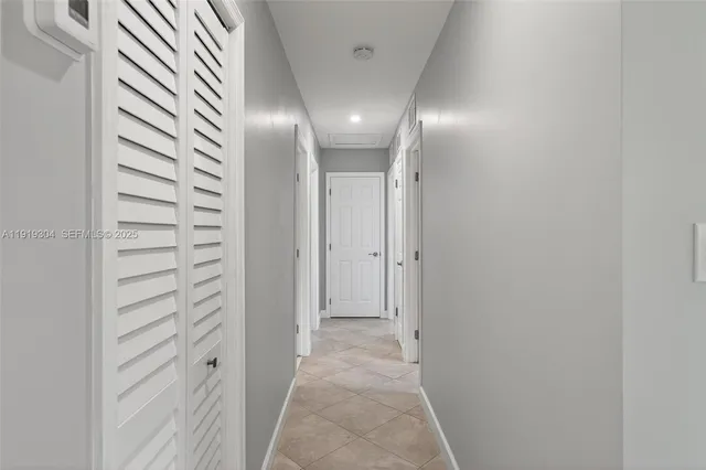 a bathroom with a sink toilet vanity and shower