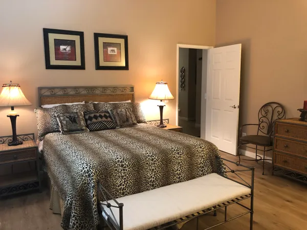 a bedroom with a bed and a table