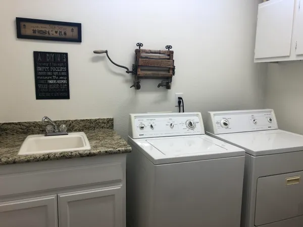 a utility room with dryer and washer