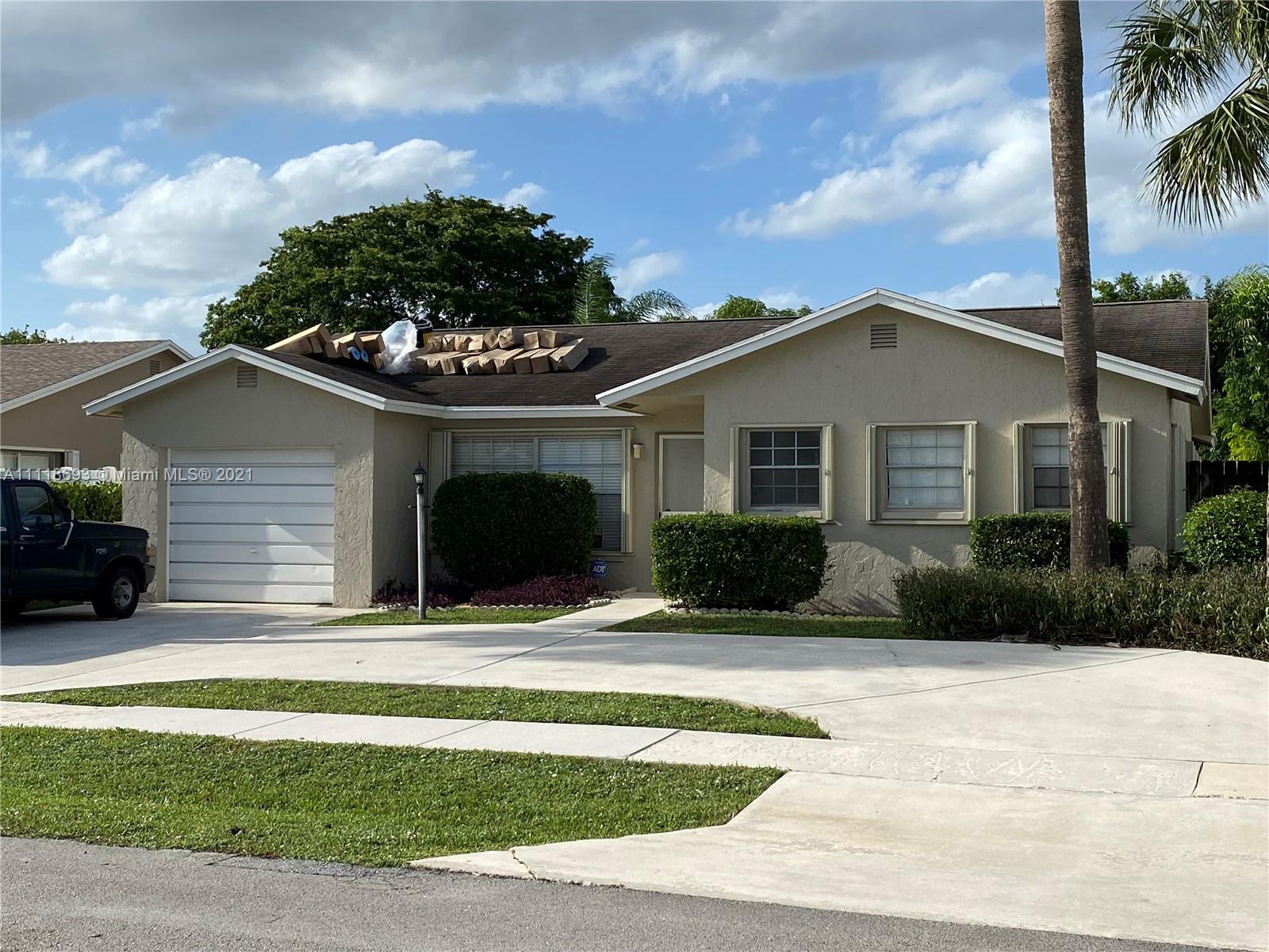 9191 Southwest 18th Road Boca Raton, FL 33428 - Photo 11 of 23 a front view of a house with a yard