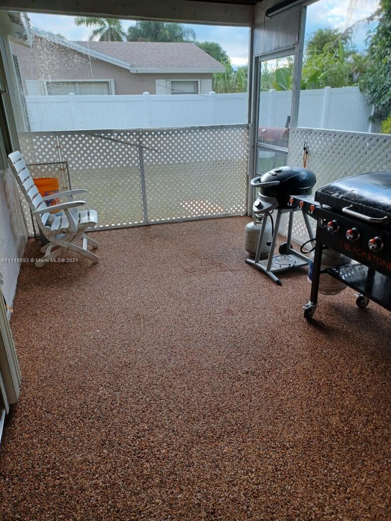 9191 Southwest 18th Road Boca Raton, FL 33428 - Photo 20 of 23 a view of a patio with table and chairs
