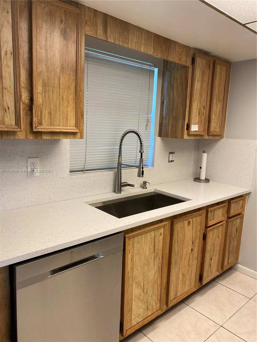 9191 Southwest 18th Road Boca Raton, FL 33428 - Photo 5 of 23 a close view of sink and cabinets