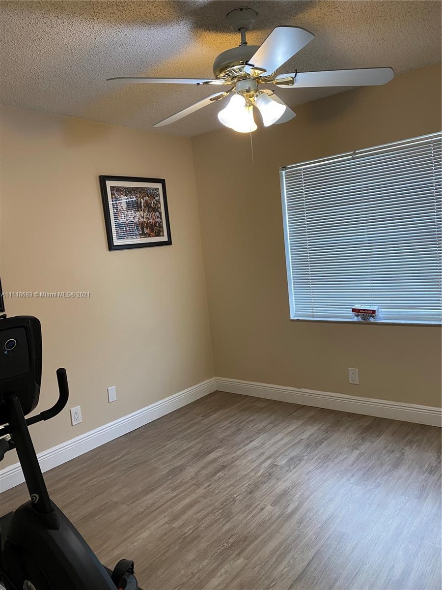 9191 Southwest 18th Road Boca Raton, FL 33428 - Photo 9 of 23 a view of wooden floor and windows in a room